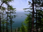 Our boat is exploring the way for approach to the shallow shore to pick us up at the northern tip of the island.