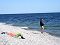 Baikalo-Lensky Nature reserve - A man fishing and woman laying on the shore