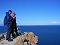 Couple standing on the rock - panoramic view of lake Baikal