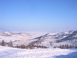 Tour to Baikal - Tour to Olkhon: Approaching Olkhon Island - Lake Baikal is infront.