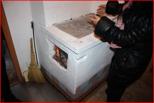 Warming up near the wood burning stove in Olkhon island